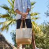 Man On Beach Holding Jute Based Canvas Shopper Bag