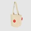 small tote bag in natural fabric with red screen print and label
