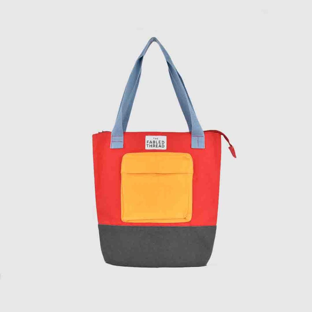 brightly coloured bag with handle