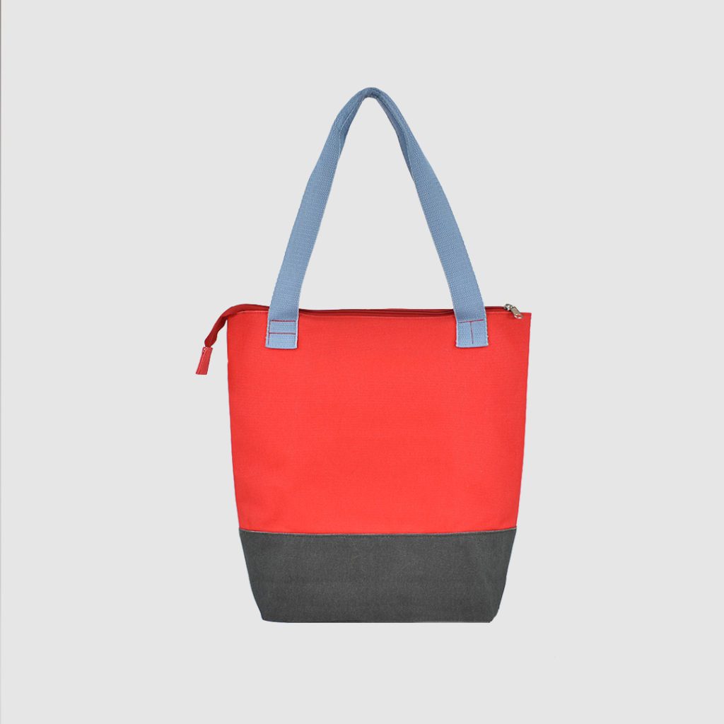 Custom heavyweight canvas bag with red bag panel and grey base plus blue handles