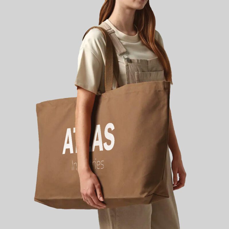 woman carrying brown oversized tote bag