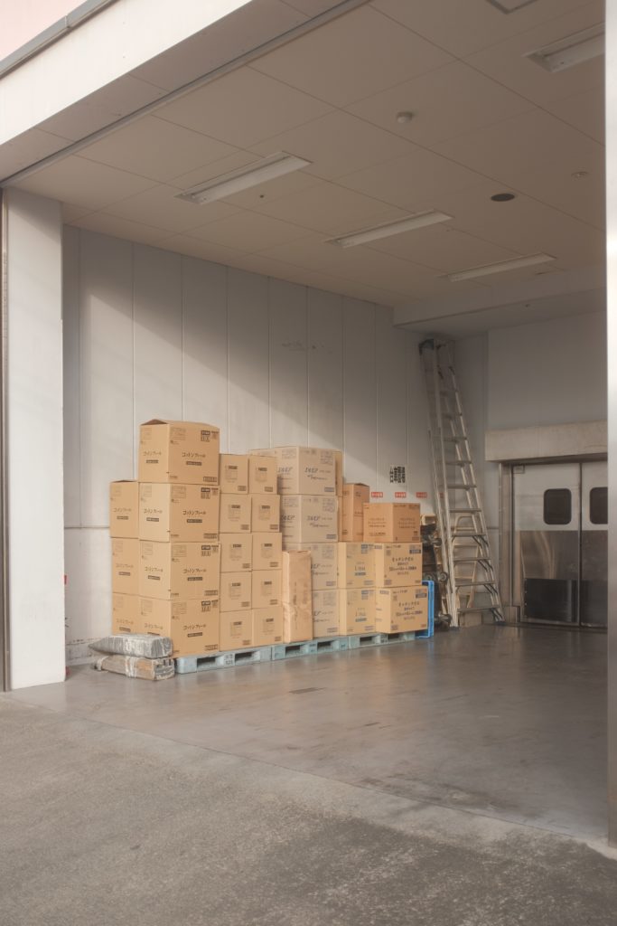 brown storage boxes in warehouse
