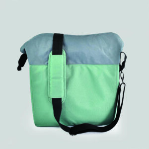 side view of picnic bag with adjustable strap draped over the top