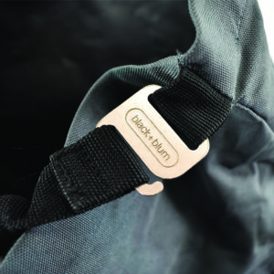 engraved metal buckle on bag in development stage