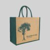 side view of square tote bag with green side panels, handles and print