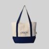 natural bag with navy blue base and handles