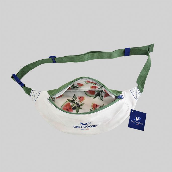 Grey Goose branded belt bag with green adjustable straps