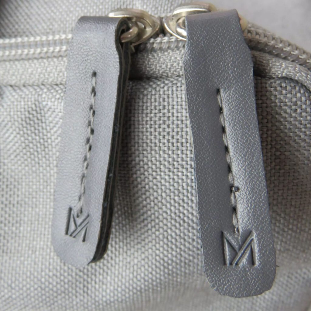 embossed zip pulls in grey on yoga bag